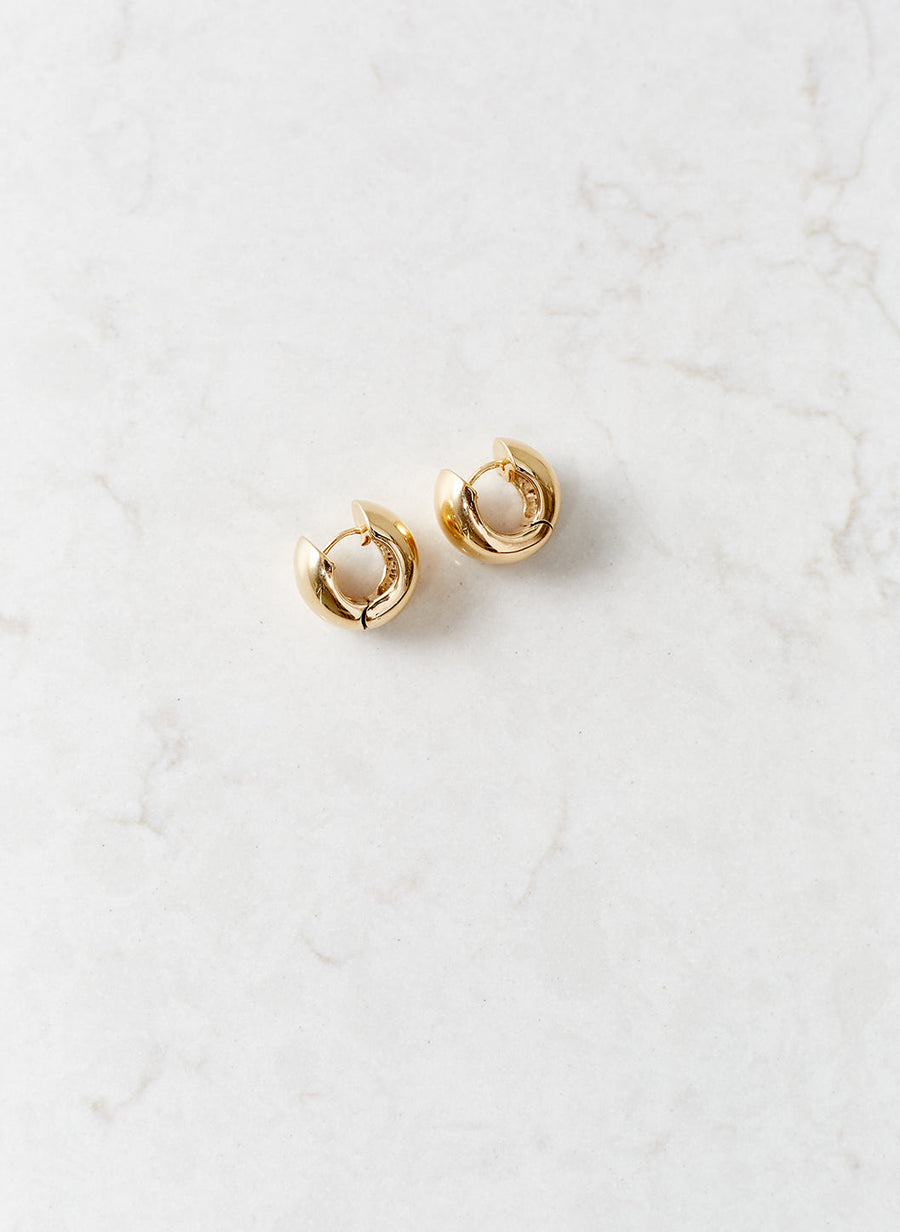 gold-huggy-hoop-earrings_studio_image 