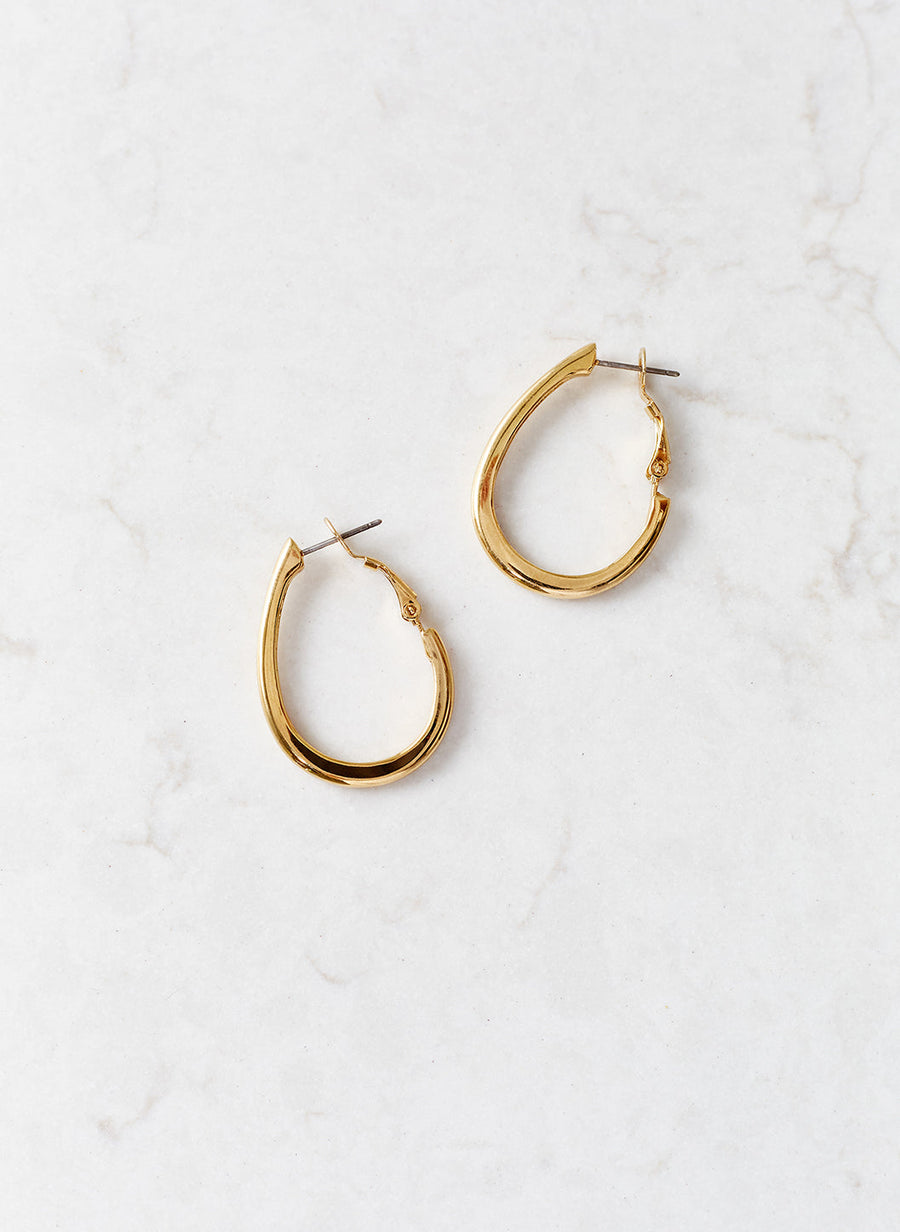 gold-oval-hoop-earrings_studio_image 